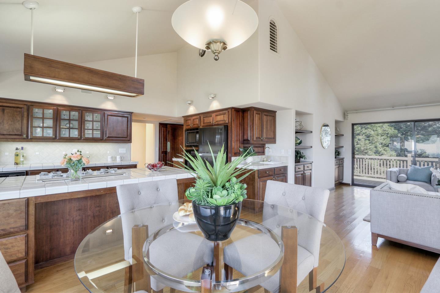 6840 Buckingham Boulevard Berkeley, CA 94705 - Photo 48 of 50 a dining room with furniture and a potted plant