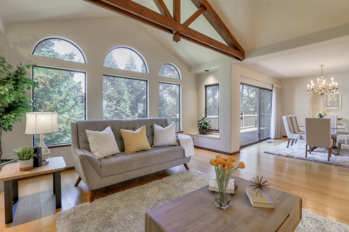 6840 Buckingham Boulevard Berkeley, CA 94705 - Photo 49 of 50 a living room with furniture a fireplace and a chandelier