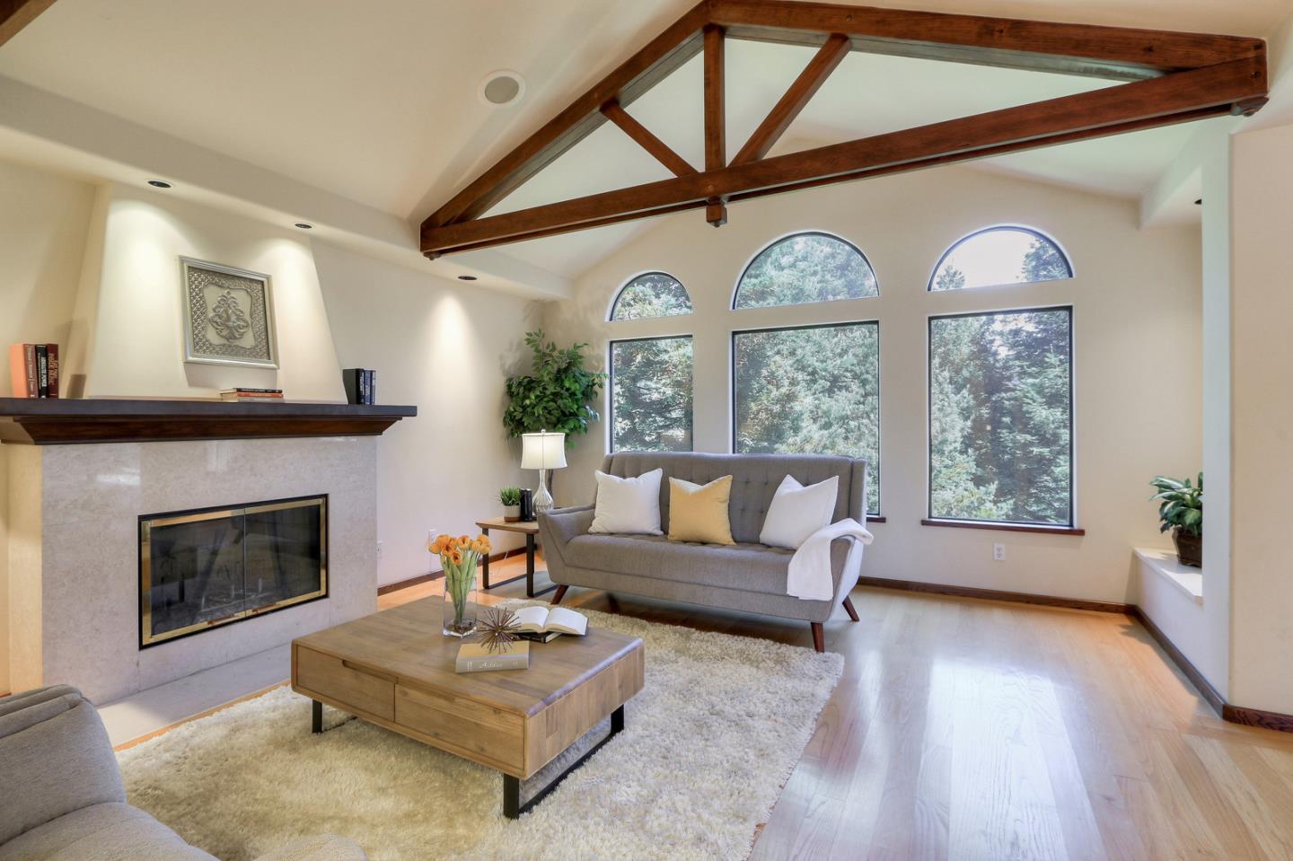 6840 Buckingham Boulevard Berkeley, CA 94705 - Photo 50 of 50 a living room with furniture and a fireplace