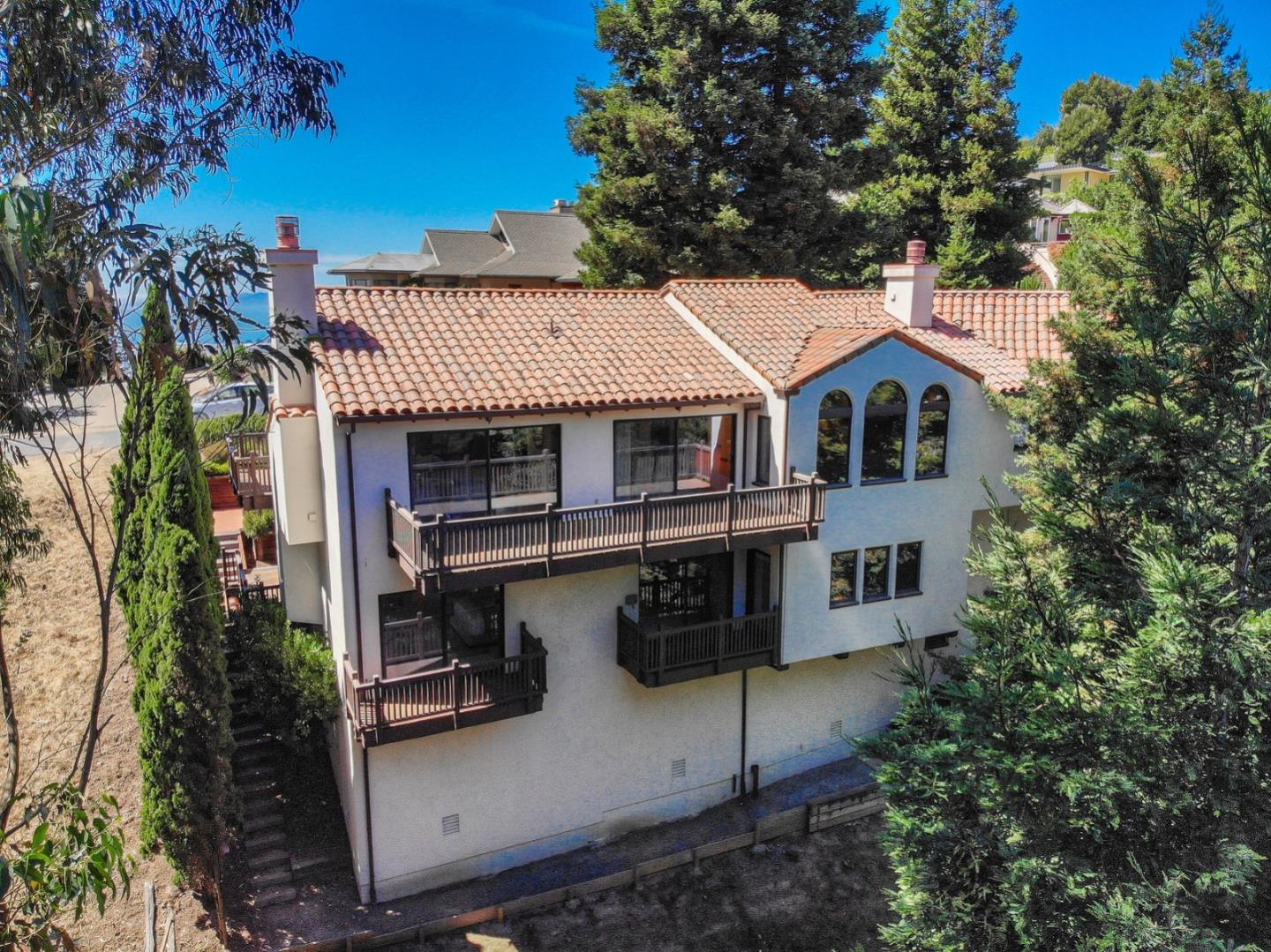 6840 Buckingham Boulevard Berkeley, CA 94705 - Photo 5 of 50 a front view of a house with a yard and garage