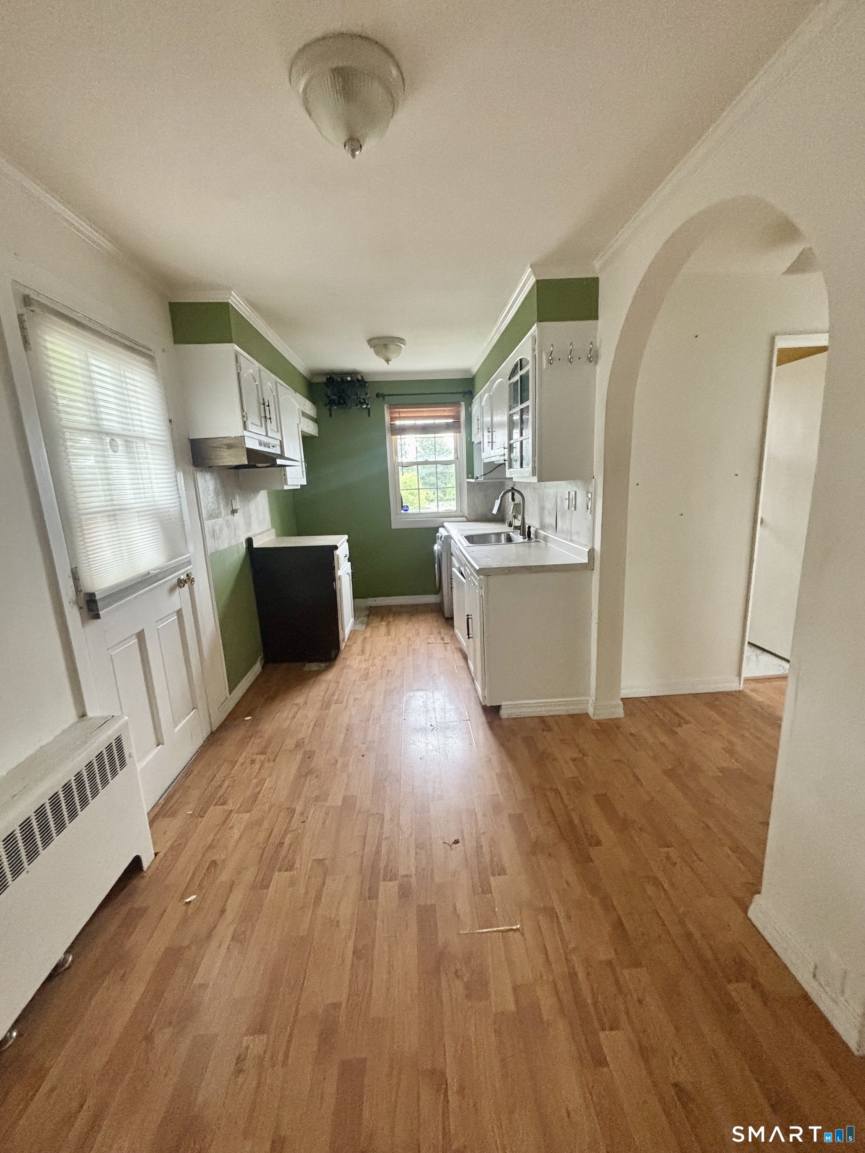 74 Standish Road, Unit 3 Stamford, CT 06902 - Photo 12 of 22 a view of a kitchen with furniture and wooden floor