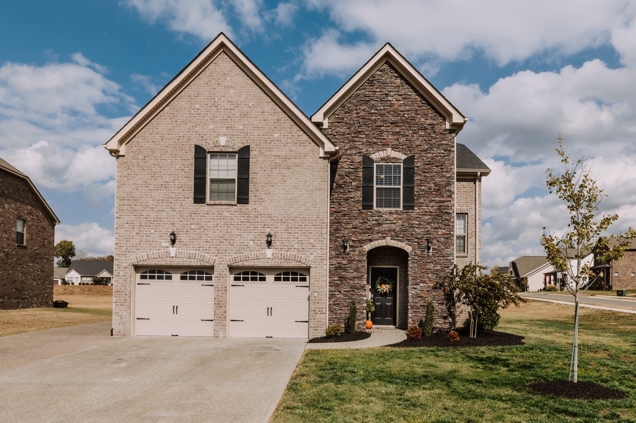 a view of house with yard and entertaining space