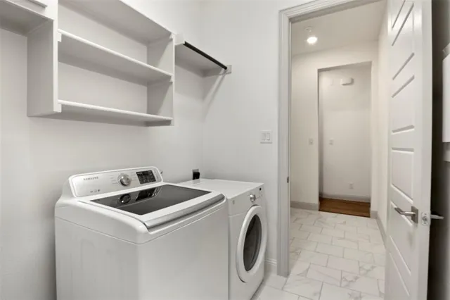a utility room with dryer and washer