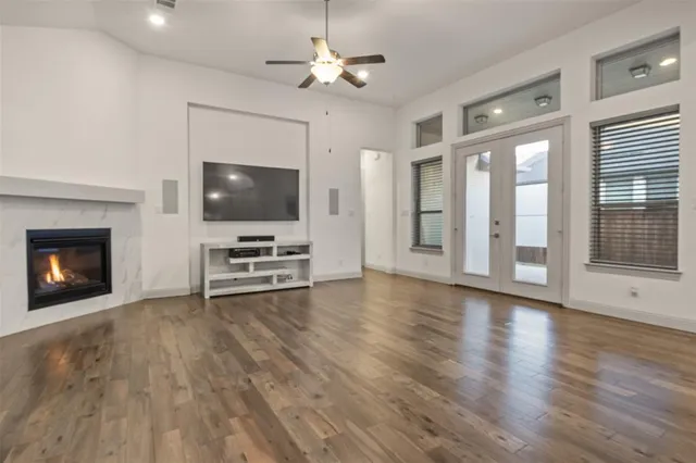 a view of livingroom with hardwood floor and a ceiling fan