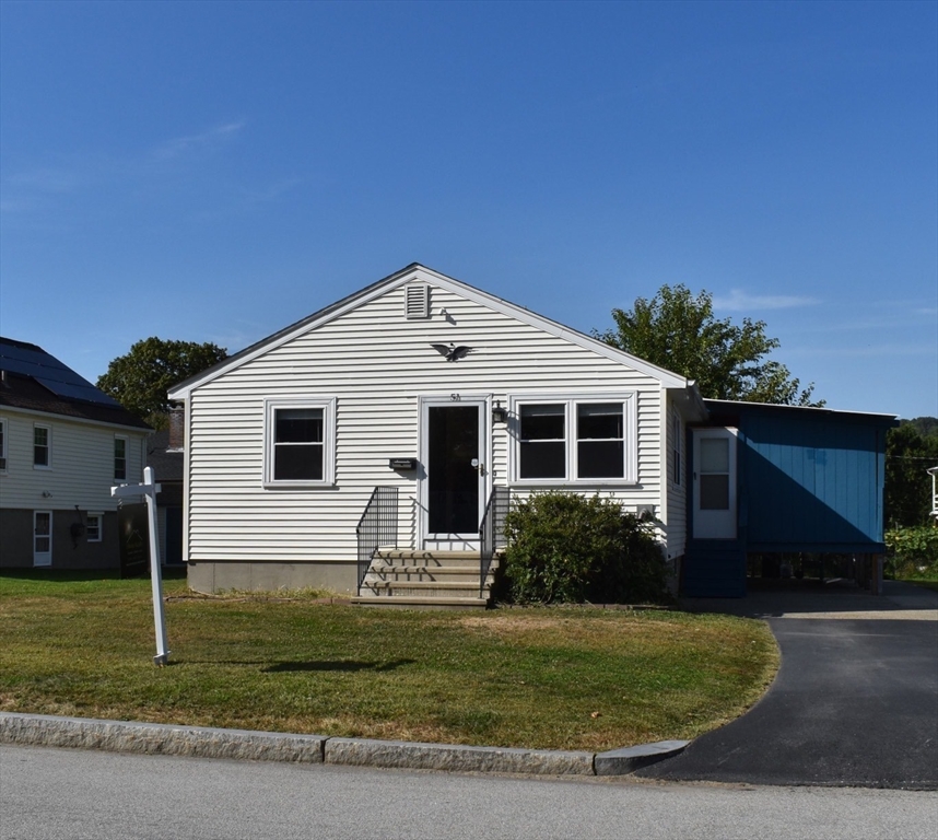 a view of a house with a yard