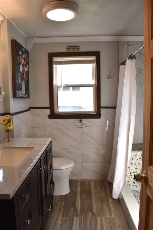 51 Bedford Avenue Worcester, MA 01604 - Photo 12 of 19 a bathroom with a sink and a mirror