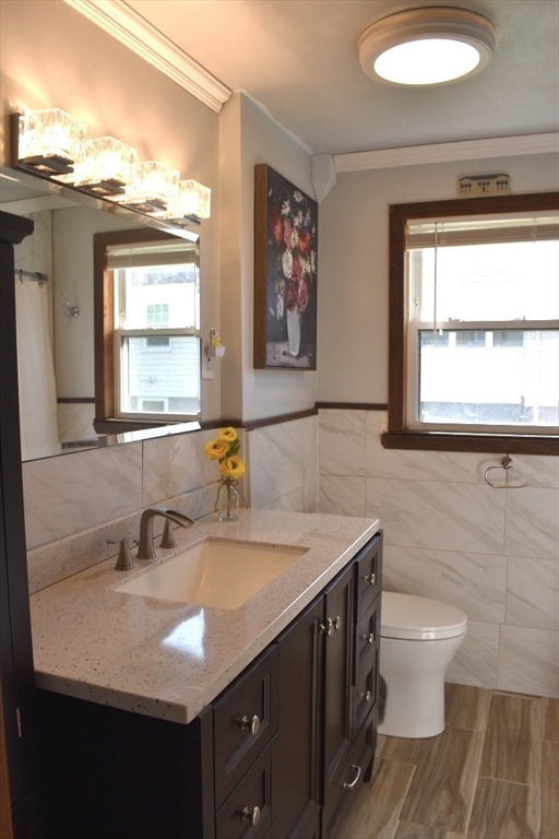 51 Bedford Avenue Worcester, MA 01604 - Photo 13 of 19 a bathroom with a sink a toilet and a window