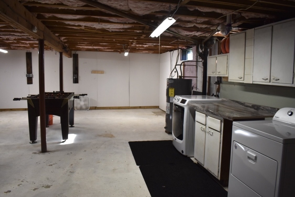 51 Bedford Avenue Worcester, MA 01604 - Photo 14 of 19 a kitchen with stainless steel appliances granite countertop a stove a sink and a microwave