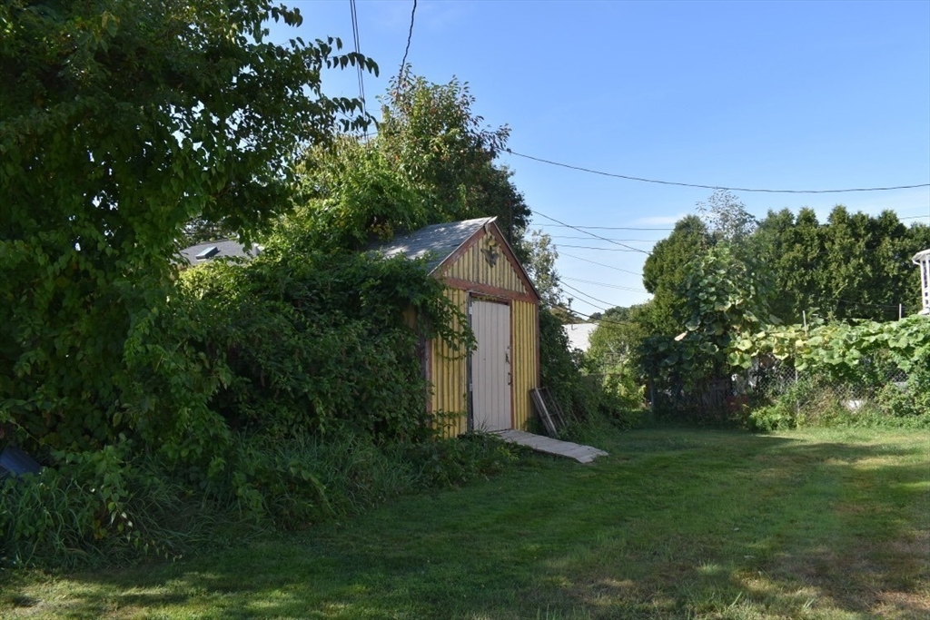51 Bedford Avenue Worcester, MA 01604 - Photo 19 of 19 a backyard of a house with lots of green space