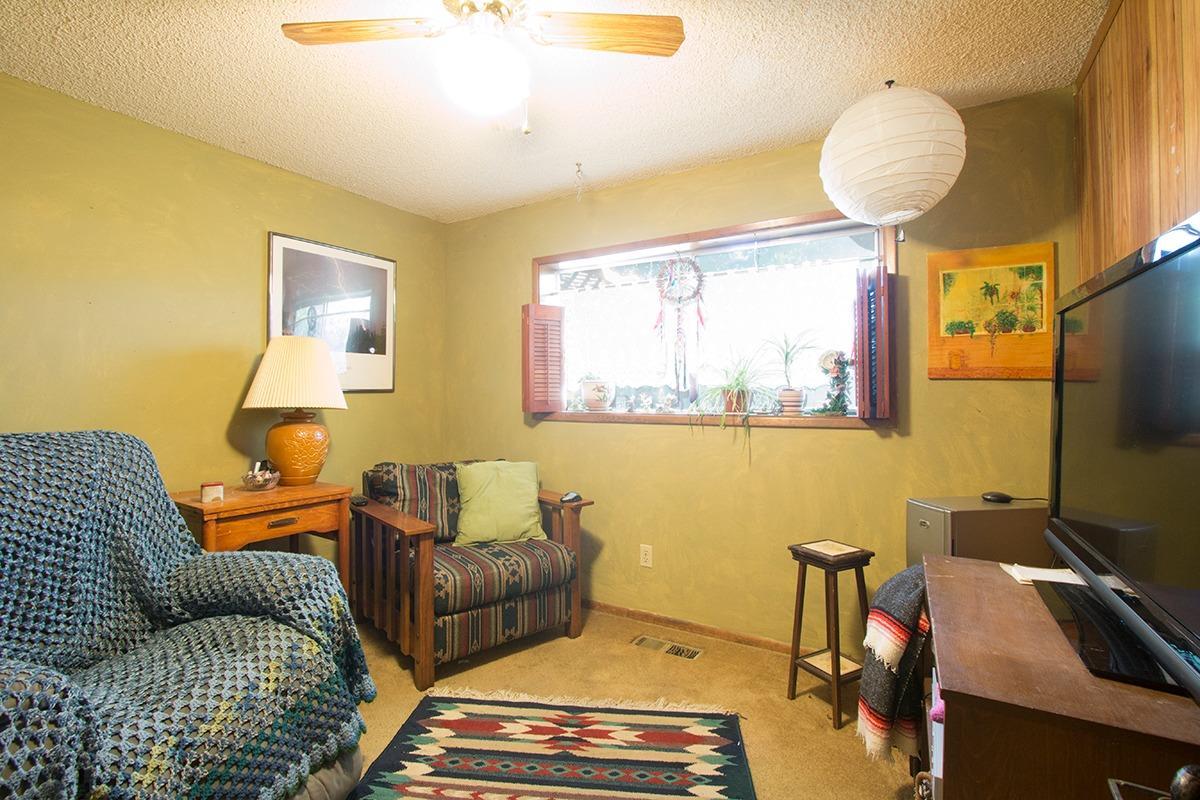 8288 Division Road White City, OR 97503 - Photo 9 of 15 a living room with furniture and a flat screen tv