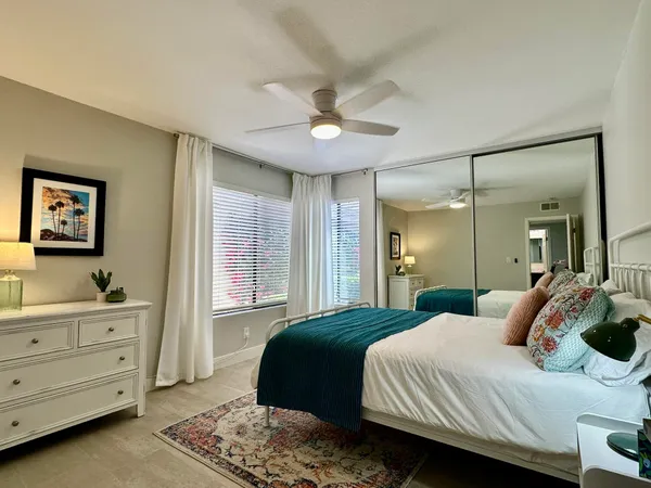 a bedroom with a bed and a dresser