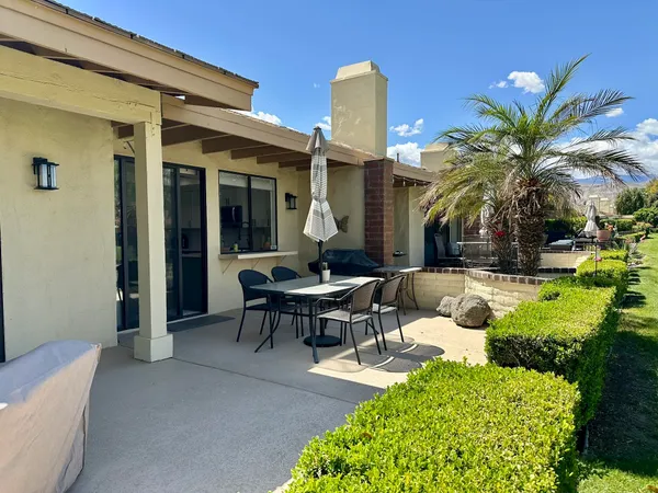 a view of a house with backyard porch and patio