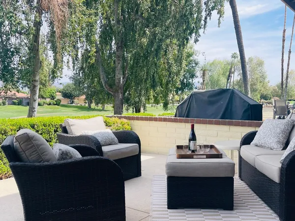a view of yard with outdoor seating and green space