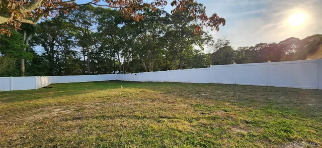 a view of a workspace with furniture and wooden floor