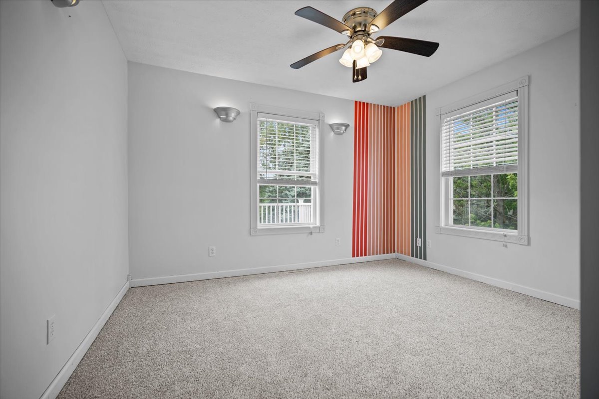 561 County Road 2000 East Secor, IL 61771 - Photo 14 of 31 an empty room with windows and chandelier fan