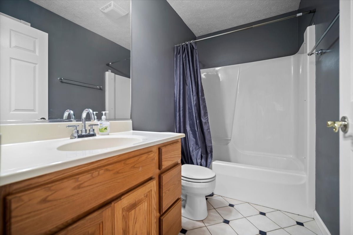 561 County Road 2000 East Secor, IL 61771 - Photo 15 of 31 a bathroom with a sink toilet and shower
