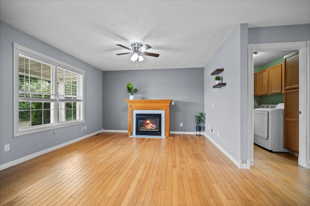 561 County Road 2000 East Secor, IL 61771 - Photo 3 of 31 a view of an empty room with a window and fireplace