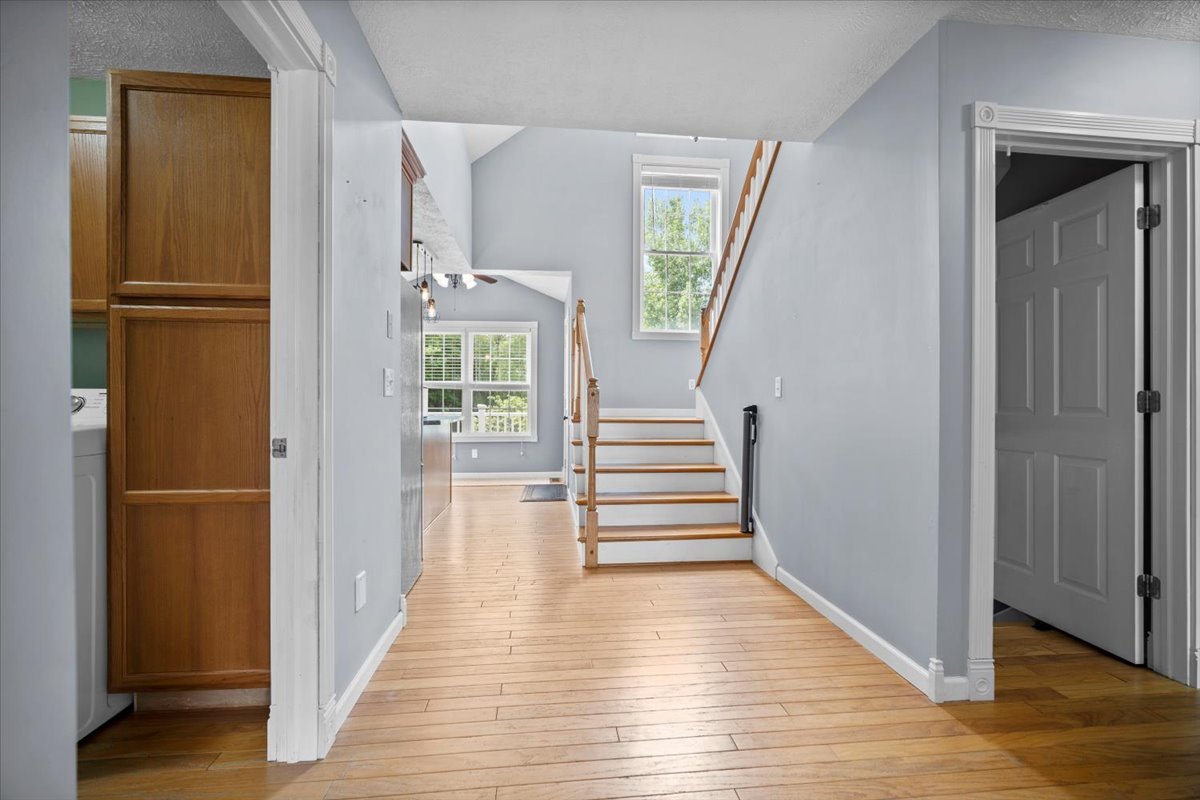 561 County Road 2000 East Secor, IL 61771 - Photo 6 of 31 a view of a hallway with wooden floor windows and entryway