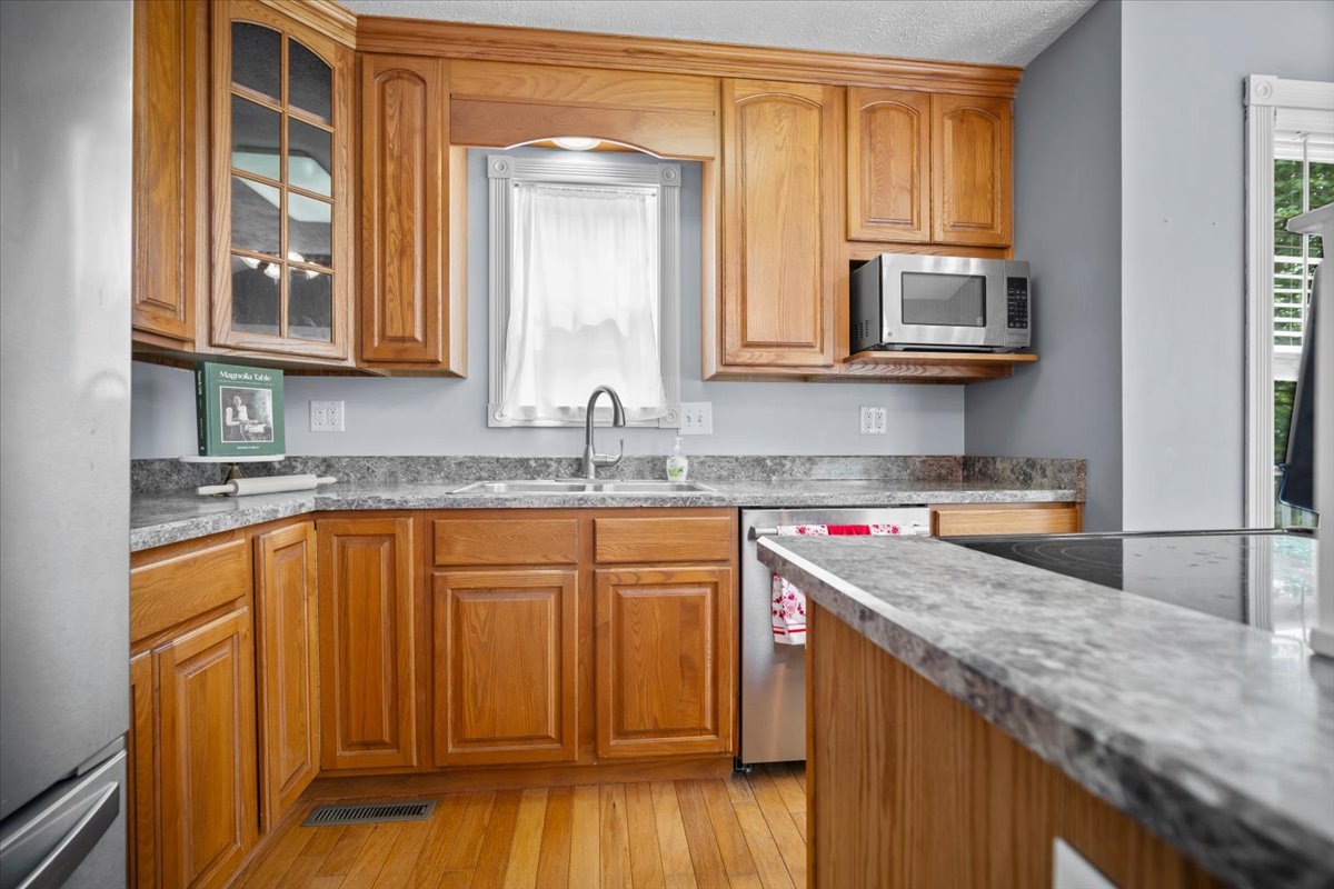 561 County Road 2000 East Secor, IL 61771 - Photo 7 of 31 a kitchen with stainless steel appliances granite countertop a sink stove and cabinets