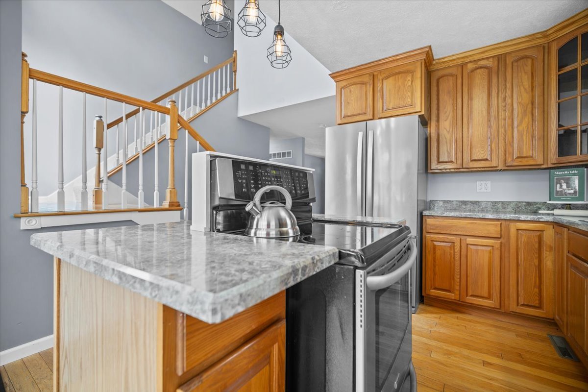 561 County Road 2000 East Secor, IL 61771 - Photo 8 of 31 a kitchen with kitchen island granite countertop a sink a counter space and cabinets