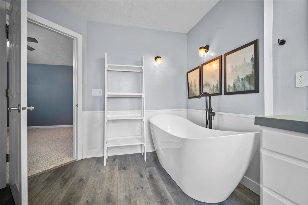 561 County Road 2000 East Secor, IL 61771 - Photo 10 of 31 a living room with a sink and a large mirror next to a window