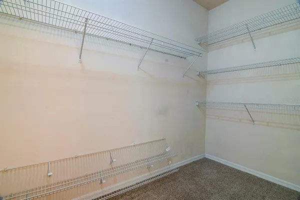 a view of a room with racks on the wall