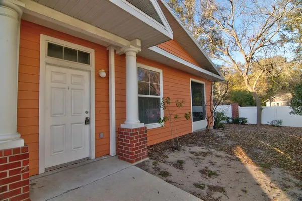 a view of a house with a snow in the road