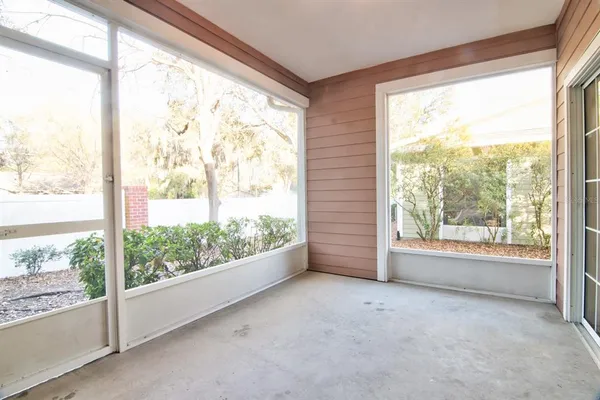 a view of a big room with an empty space and balcony