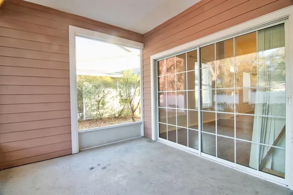 a view of empty room with windows