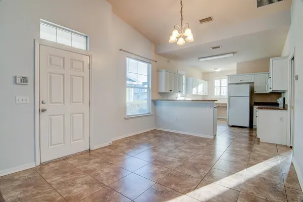 a view of a kitchen with a stove cabinets and a kitchen