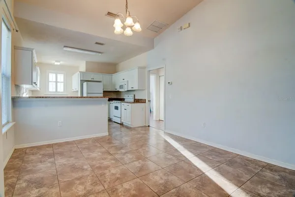 a view of a kitchen with a sink cabinets and window
