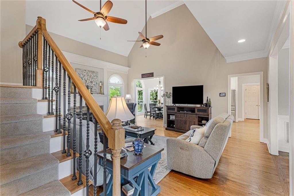 802 Clubhouse Pointe Woodstock, GA 30188 - Photo 14 of 66 a living room with furniture flat screen tv and a fireplace