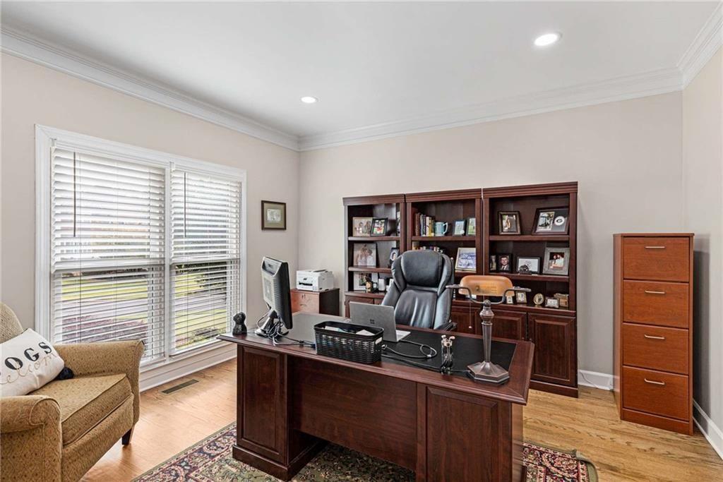 802 Clubhouse Pointe Woodstock, GA 30188 - Photo 23 of 66 a living room with furniture window and book shelf