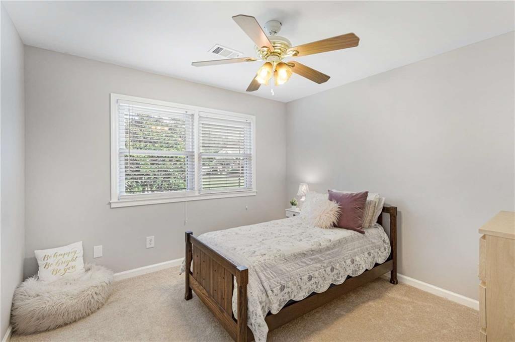 802 Clubhouse Pointe Woodstock, GA 30188 - Photo 40 of 66 a bedroom with a bed and a window