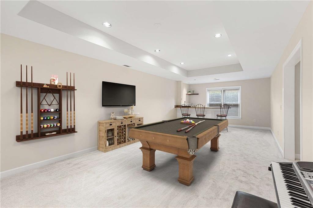 802 Clubhouse Pointe Woodstock, GA 30188 - Photo 48 of 66 a living room with furniture and a flat screen tv