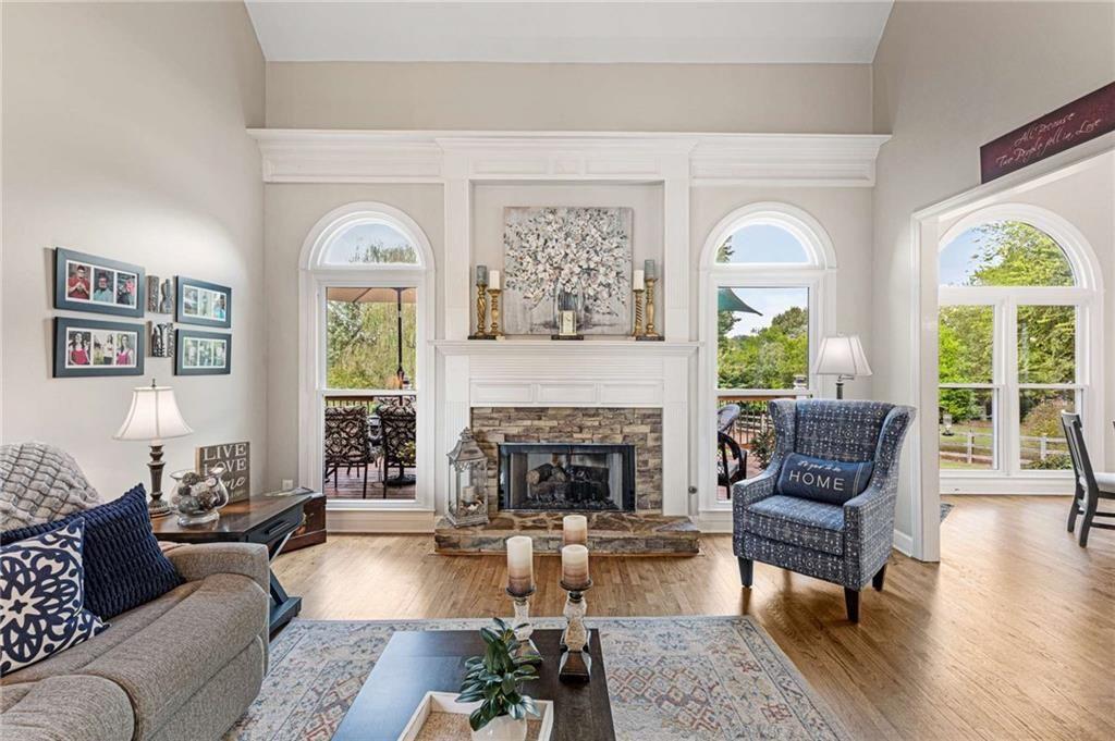 802 Clubhouse Pointe Woodstock, GA 30188 - Photo 5 of 66 a living room with furniture and a fireplace