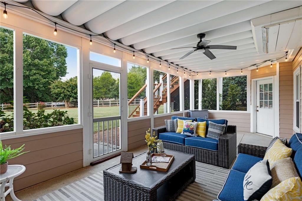 802 Clubhouse Pointe Woodstock, GA 30188 - Photo 56 of 66 a living room with furniture and a large window