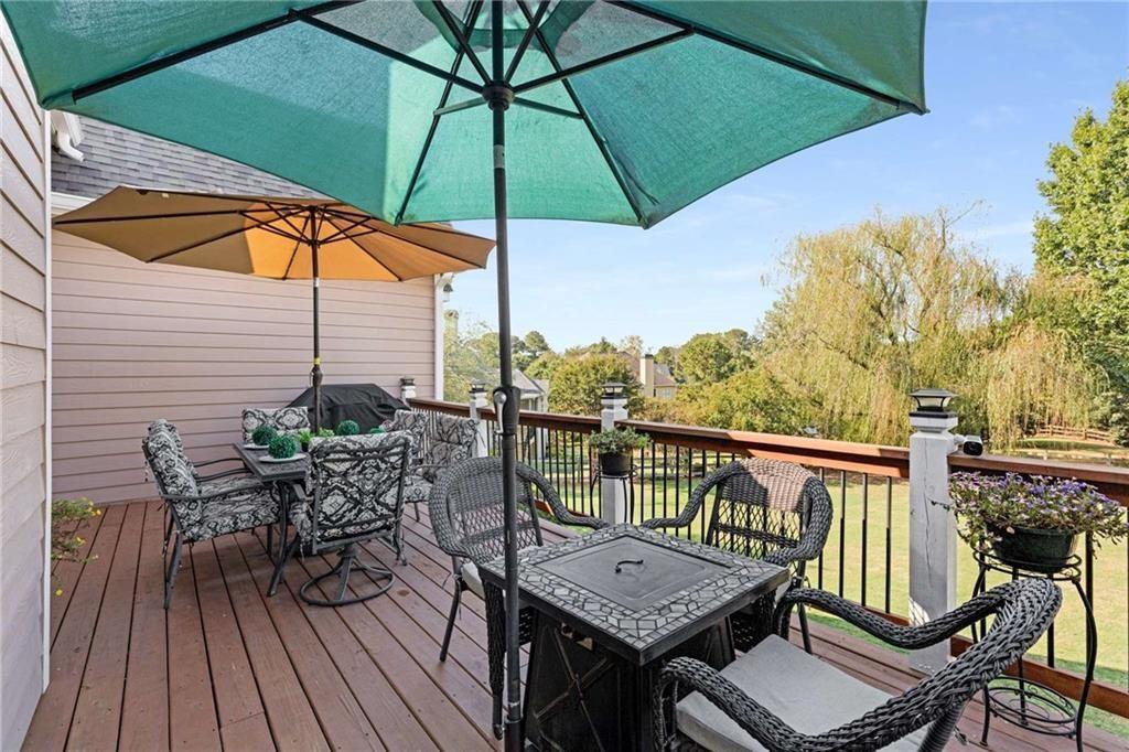 802 Clubhouse Pointe Woodstock, GA 30188 - Photo 57 of 66 an outdoor space with furniture and umbrella
