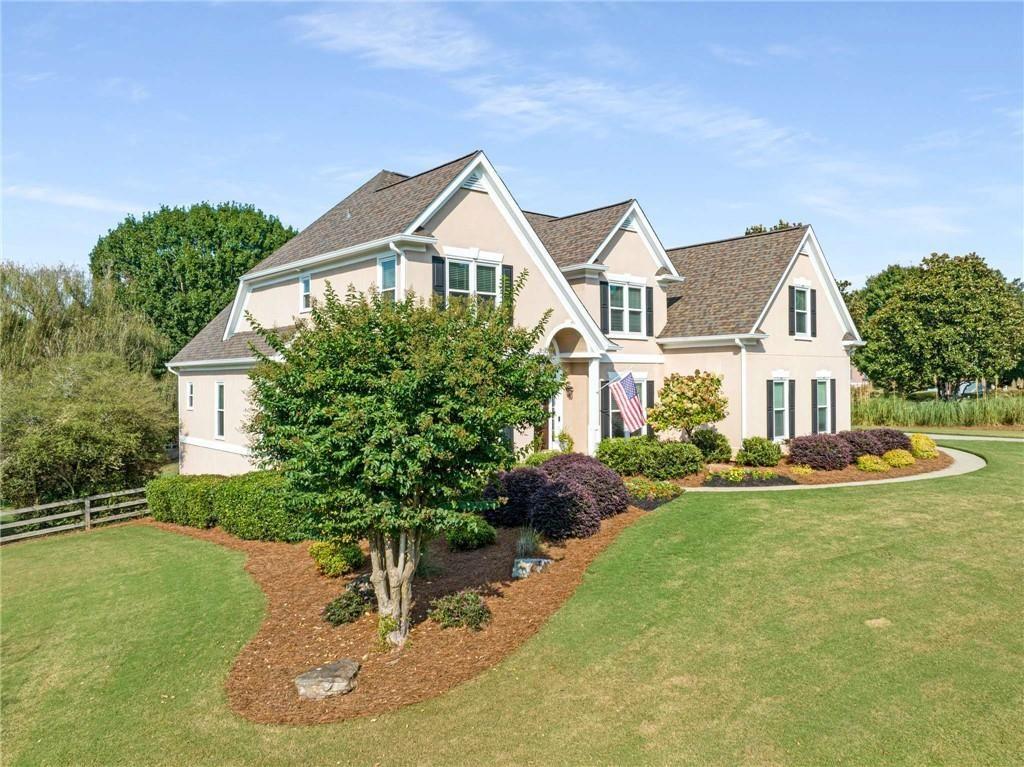 802 Clubhouse Pointe Woodstock, GA 30188 - Photo 62 of 66 a front view of a house with a yard