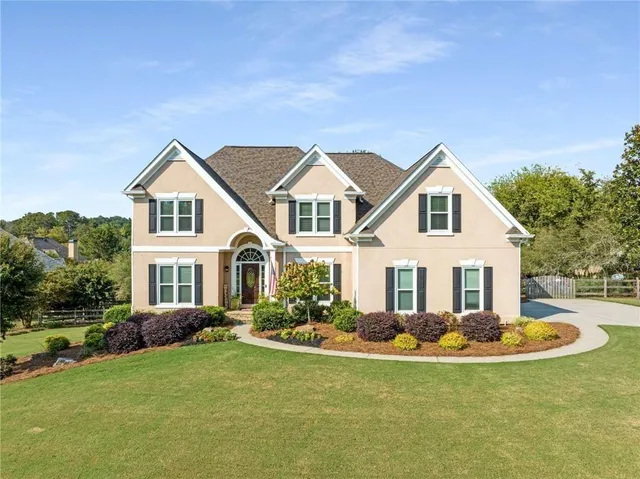 a open kitchen with stainless steel appliances granite countertop a stove a sink dishwasher a refrigerator with wooden floor