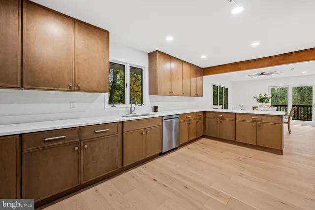 a kitchen with stainless steel appliances a refrigerator and a sink