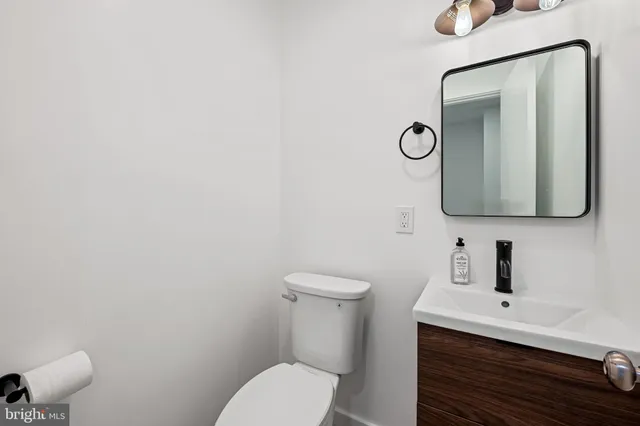 a bedroom with a bed and a table