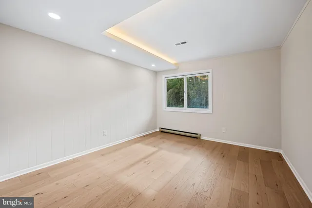 a house that has a tree in front of it