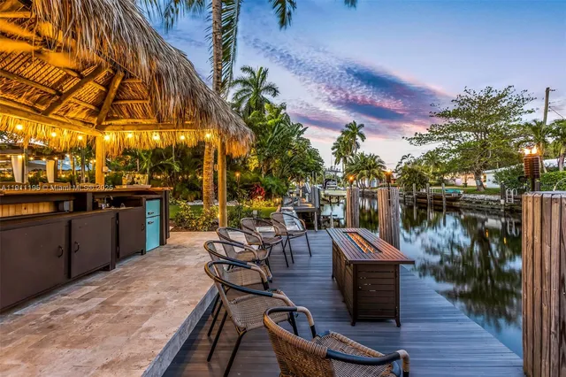 a view of a outdoor kitchen and sitting area