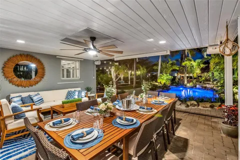 a outdoor dining space with furniture and outdoor view