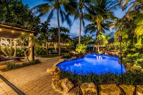 a view of a swimming pool with an outdoor space and seating area