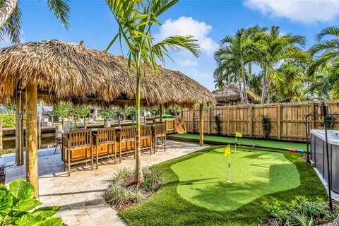a view of a chairs and table in the patio