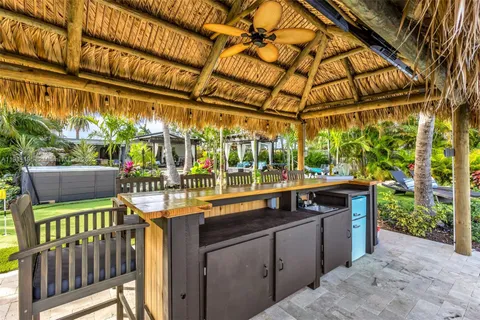 a patio with water view with outdoor seating