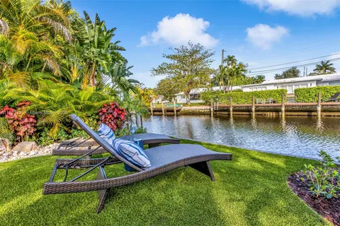 a view of yard with swimming pool and green space
