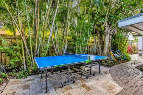 a view of yard with swimming pool and sitting area